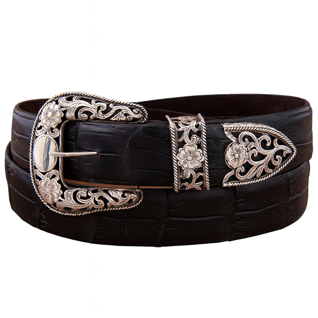 Black leather belt with silver filigree floral buckle on a white background
