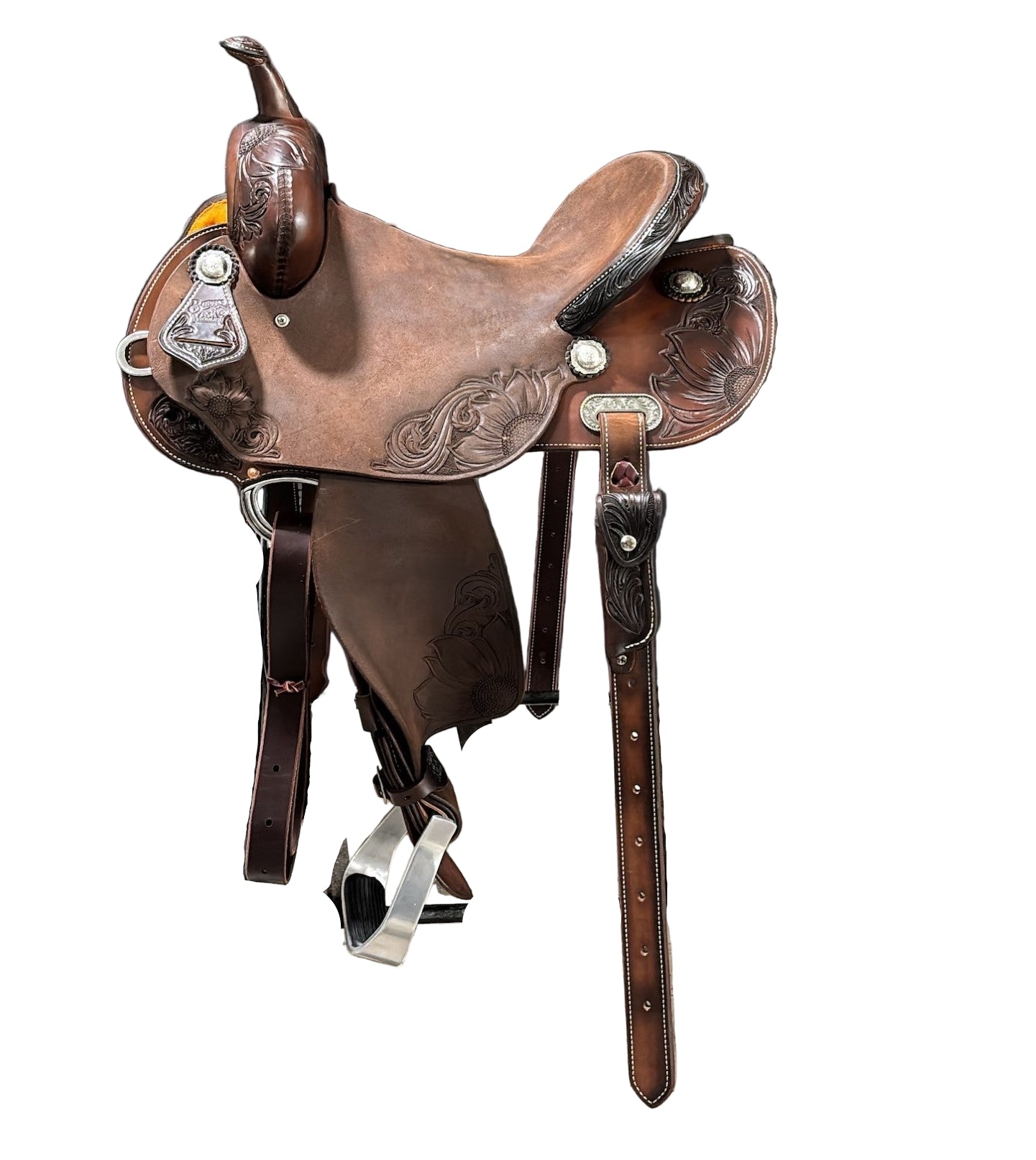 Brown leather saddle on a stand with a white background.