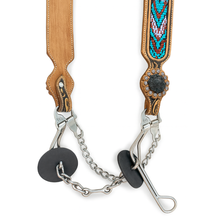 Decorative horse bit with wooden and beaded accents on a white background